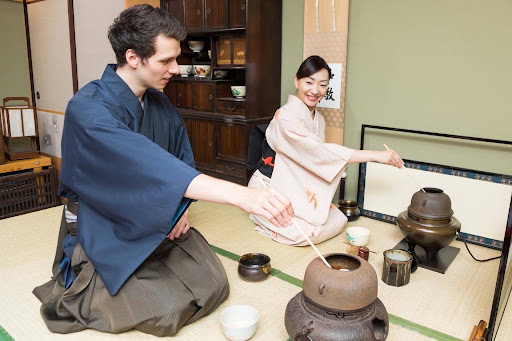 A traveler speaking Japanese during a cultural experience in Japan